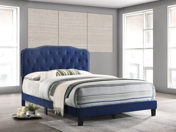 navy velvet upholstered panel bed with silver nailhead design